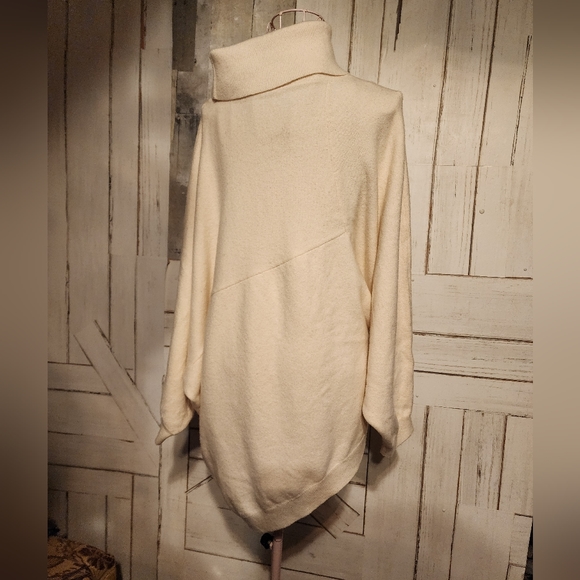 A symmetrical turtle neck sweater. - Picture 2 of 6